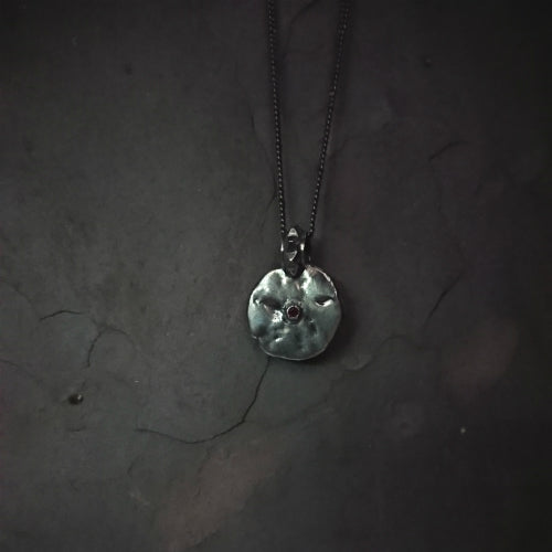 MOON PENDANT IN SILVER WITH SINGLE RHODALITE GARNET